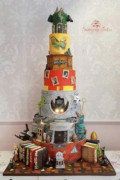 a cake made to look like a tower with pictures on it