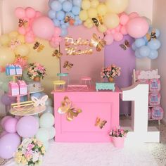 a birthday party with balloons and decorations