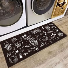 a kitchen rug with the words happy birthday written on it next to a washer and dryer