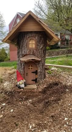 a gnome's house made out of a tree stump