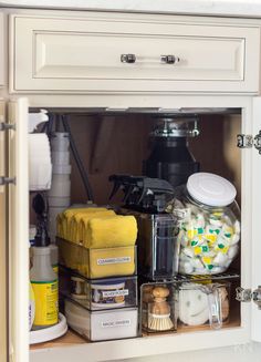 an open cabinet with various items in it