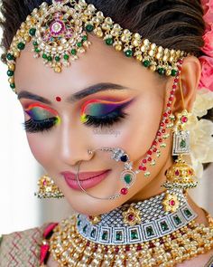 a woman with makeup and jewelry on her face