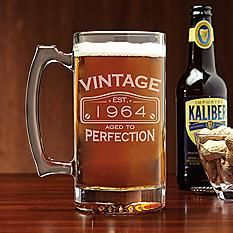 an old fashioned beer mug with ice cream in front of it