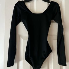 So Danca Black Long Sleeve Leotard. Never Worn Solid Stretch Leotard With Lined Body, Stretch Party Leotard, Party Leotard Solid Color With Stretch, Solid Stretch Party Leotard, Solid Color Dancewear Bodysuit For Party, High Stretch Solid Bodysuit For Dancewear, Dancewear Bodysuit For Parties, Fitted One-piece Elastane Leotard, Dancewear Bodysuit With Lined Body For Party