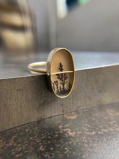 A tree-like dendritic agate is Captured in 14k gold. One-of-a-kind. Areas Of Life, Lone Tree, Dendritic Agate, Oval Ring, Oval Rings, Agate Ring, The Stone, Cufflinks, Agate