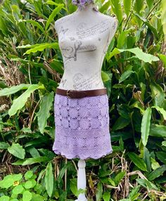 a short cotton crochet skirt hand dyed a muted mauve colour  lined with lightweight cotton muslin with crochet ruffle edging  & with a drawstring that ties at the back  SIZE xs, s, m, l adaptable depending on the amount of gathering desired....the ungathered waist/ hip measures 100cm / 39" length 43cm / 17" mannequin is small cool gentle wash  belt is not included in the sale Bohemian Cotton Fitted Mini Skirt, Bohemian Fitted Cotton Mini Skirt, Fitted Bohemian Cotton Mini Skirt, Summer Mini Skirt With Crochet Trim, Bohemian Cotton Mini Skirt, Bohemian Crochet Lace Fitted Skirt, Spring Festival Crochet Trim Skirt, Spring Festival Skirt With Crochet Trim, Bohemian Skirt With Crochet Trim For Spring