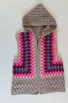 a crocheted vest with a hood on it