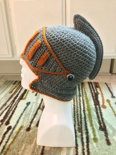 a crocheted hat on top of a mannequin head