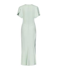 a white dress with short sleeves on the shoulders and an asymmetrical neckline