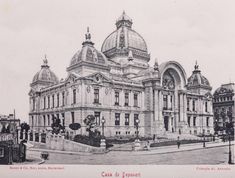 an old black and white photo of a large building with domes on it's roof