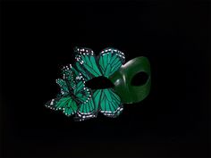 Emerald Green Masquerade Mask inspired by green butterflies, perfect for elegant masquerade occasions! I N C L U D E D Masks come with satin ribbons attached.   S H I P P I N G -  Processed same day or within 24 hours.  1-2 day guaranteed delivery, add item to cart, click shipping tab for rates.  Pls leave a check out note with your need date & contact number  Msg for delivery time frames (Include your state/country) S I Z E  Adult size. Dimensions available upon request.  C U S T O M I Z A T I Green Masquerade Mask For Mardi Gras Party, Green Masquerade Mask, Emerald Green Butterfly, Butterfly Masquerade Mask, Butterfly Masquerade, Elegant Face Mask, Green Butterflies, Thank You Wishes, Ball Mask