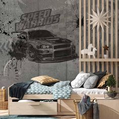 a bedroom with a bed, dresser and wall mural in the shape of a car