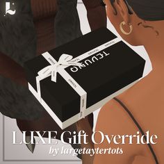 a woman holding a black box with a white ribbon on it and the words luxury gift overlaid