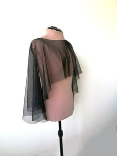 "Halloween cape, Black tulle  capelet, , Witch cover up This is simply  tulle cape, will be perfect compliment for your Halloween dress, Gothic or Vampire look.  Also It has a romantic yet minimalist feel, and would match many gown styles. DETAILS COLOR   - Black  LENGTH  front side- 30 cm (11,8'') back side 50 cm (20 \") SIZE  One size **IMPORTANT** * CUSTOMER WILL PAY FOR SHIPPING IN CASE OF RETURN *colours may vary from originals depending on computer monitor or smartphone settings. The produ Fitted Gothic Cape For Costume Party, Elegant Fitted Cape For Costume Party, Black Cape For Costume Party, Chic Black Cape With Cape Sleeves, Witchy Black Cape For Halloween, Fitted Fall Cape For Evening Wear, Chic Capelet With Cape Sleeves For Party, Chic Capelet For Party, Black Evening Cape