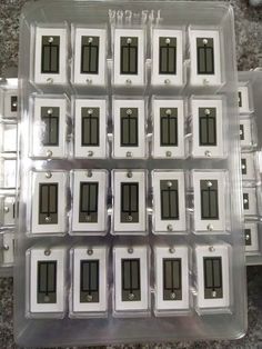 many white and black electrical switches in plastic cases