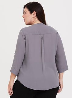 A split neck and tab sleeves lend polish to a smooth georgette blouse that has graceful movement and versatile styling appeal. Georgette fabric. Split neck with concealed button placket. Tab sleeves. Chest pockets. Shirttail hem. CONTENT + CAREPolyester. Wash cold; tumble dry. Imported plus size tops. SIZE + FITModel is 5'9”, size 1. Size 2 measures 30” from shoulder. The best plus size women's harper georgette pullover 3/4 sleeve blouse the in dark pearl grey made of georgette. These dressy clothes and work-wear, office-wear, career-wear, and business-wear will make you look professional to nail your job interview and wear to work every day. Torrid is your destination for cozy fall and winter clothes to keep you warm and comfortable. Dark Pearl, Red Chucks, Georgette Blouse, Career Wear, Georgette Fabric, Pearl Grey, Tunic Shirt, Plus Size Tops, Cut And Style