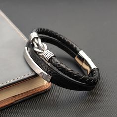 This stylish triple layer leather bracelet is crafted with high quality stainless steel and PU materials. The combination of stainless steel and PU makes it durable and comfortable to wear. Elevate any outfit with this must-have accessory. Modern Stainless Steel Double Band Bracelets, Modern Leather Bracelet With Metal Black Band, Silver Minimalist Leather Bracelet, Modern Metal Leather Bracelet With Black Band, Modern Stainless Steel Braided Bracelets For Everyday, Everyday Stainless Steel Bracelet With Leather Strap, Silver Leather Bracelet With Stainless Steel Clasp, Modern Leather Braided Bracelet With Stainless Steel Clasp, Modern Black Leather Bracelet With Stainless Steel Clasp