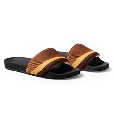 Introducing our Sand Desert Men's Slides, a perfect blend of style and comfort for the modern man. Crafted with meticulous attention to detail, these slides effortlessly combine the rugged charm of the desert with a contemporary design. Ideal for casual outings or lounging by the pool, our Sand Desert Men's Slides are a must-have addition to your footwear collection. Shop now and experience the ultimate comfort and style that our slides have to offer. Men's Slides Product Details:• Strap Comfort Outdoor Brown Slippers With Textured Footbed, Brown Slides With Cushioned Footbed, Casual Brown Slides For Outdoor, Casual Brown Outdoor Slides, Brown Slides For Vacation, Brown Slide Slippers With Textured Footbed, Comfortable Brown Slide Slippers, Brown Casual Slippers For Vacation, Casual Brown Outdoor Slippers