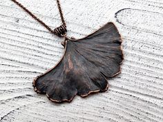 This natural leaf necklace is handcrafted with love and passion in my home studio. A beautiful pendant made from a real ginkgo biloba leaf with owl symbol, encased in thick and durable copper. I use real fresh leaf and cover it with the fine copper. This piece of jewelry is very special. It is just by the fact that it is irregular. Just as it is, it has been available in nature. Fully handmade item. Real artifact! Great gift idea for someone who likes unusual things! DETAILS: - This ginkgo bilob Nature-inspired Leaf Shaped Copper Jewelry, Electroformed Leaf-shaped Copper Jewelry, Bronze Copper Leaf-shaped Jewelry, Owl Symbol, Citrine Crystal Necklace, Real Leaf, Raw Crystal Jewelry, Owl Necklace, Ginkgo Biloba