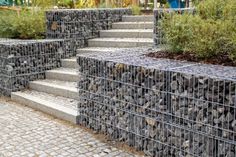 the steps are made out of concrete blocks and wire mesh fenced in with plants