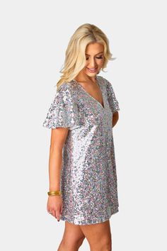 The Taya has us in our 1989 Era! She's an easy and flattering shift dress that you are sure to love! She features a v neck, flutter sleeves, keyhole button closure in the back, and multicolored sequins. Wherever you wear the Taya, compliments are sure to follow! Product Details: Fit: The Taya fits true to size. Length: The Small measures to be 32.5" from shoulder to hem. Bust: Not Fitted - comfortable room throughout midsection. Waist: Relaxed fit Fabric: Fabric contains no stretch. Material: 10 Sequin Short Dress, Sequin Dress Short, Womens Boho Dresses, Sequin Short, Embellished Headbands, Short Lace Dress, Sequin Party Dress, Sequin Shorts, Comfortable Room