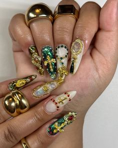 catholic core ⚜️ inspo @nailsbyaleeshah . . . catholic nails, sacred heart nails, religious nails, gold red and green nails, stiletto nails, gel x nails inspo 2024, #nailsnailsnails #nailart #gelxnails #naildesign #gelnails #gelmani #nailsofinstagram #gelx #nailtech #fypシ #explorepage✨ Catholic Nails Designs, Rosary Nails Designs, Religious Nails Designs, Catholic Nail Art, Green Nails Stiletto, Jesus Nails Designs, Nails With Cross Charm, Religious Nails, Sacred Heart Nails