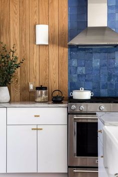 a stove top oven sitting inside of a kitchen