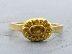 "One of a kind gold ring with Citrine. The raw yellow Citrine wrapped and decorated with 22k gold over rustic oval top made of 22k solid gold. The delicate band made of 14k solid gold, slightly hammered. Ring size : 7 3/4 (US size) - can enlarge the ring up to 8. Top ring dimension : 0.4/0.3\" (10/8 mm). 14k gold band width : 0.08\" (2 mm). The ring will be packed in a gift box ready to be given as a gift, and will be shipped via express mail service that usually takes 5-10 days to arrive. ▶ Vie Hammered Ring, Top Rings, Solid Gold Ring, Etsy Gold Ring, Citrine Ring, Yellow Citrine, Solid Gold Rings, 22k Gold, Gold Band