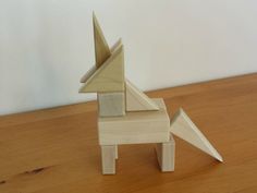 an origami horse on a wooden table