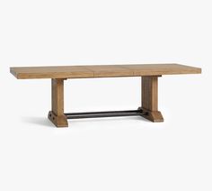 a wooden table with metal legs and a rectangular top, against a white background the table is made out of wood