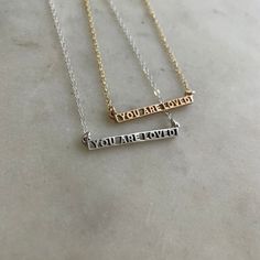 Buy in 14K Gold. You ARE loved, even on the days you think you aren't or couldn't possibly be. It's a truth we believe in. Wear or gift this as a wearable reminder of that truth. Who knows, it might just be the thing a stranger needs to see the day you're wearing it. This dainty bar necklace measures approximately 1-1/4" x 1/8" and is assembled on our Everyday Chain. To create the original version of this intricate piece, we used 3D-printed elements combined with our method of hand-carving wax. Dainty Bar Necklace, Handmade Bar, Heart Shaped Candy, You Are Loved, Birthstone Bracelets, Birthstone Earring, Who Knows, Love Necklace, Birthstone Necklace