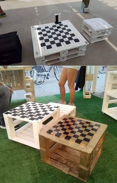 some people are playing checkers on the grass and one is standing in front of a table