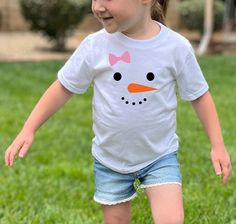 Our snowgirl toddler shirt will look great on your little one during the Christmas holiday or on your next snow day! Also available in Onesies® sizes newborn-24 months at https://www.etsy.com/listing/1089866922/snowman-onesies-for-babys-1st-christmas?click_key=88fdced251eed4bf21e04559355628871cb468d1%3A1089866922&click_sum=62f839f7&ref=shop_home_active_8 We offer sizes 2T, 3T, 4T, and 5T for all shirt designs.  If you are looking for a baby Onesies® be sure to check out the rest of our shop as s Girl Snowman, Winter Holiday Outfits, Kid Christmas, Snowman Shirt, Girl Holiday, Snow Girl, Snowman Faces, Preschool Christmas, Toddler Christmas