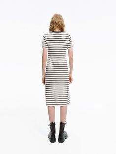 MO&Co. Women's Round Neck Striped Dress Crafted with a blend of wool and fabric, this mid-length T-shirt dress boasts a modern silhouette and stylish striped design. Perfectly pair with short boots for a minimalist, fashion-forward look. Features : - Midi T-shirt dress silhouette- Classic black and white stripes- Round neck, short sleeves Code: MBD1DRS038The back length of size S is 104cmMATERIALS & CARE Material: 67.7% Wool 32.3% PolyesterWrap metal parts before dry cleaning.REMINDER: All items Casual Striped Midi Dress For Fall, Casual Striped Knee-length Midi Dress, Striped Midi Dress For Work, Striped Knee-length Midi Dress For Work, Fall Striped Knee-length Midi Dress, Striped Short Sleeve Fall Dresses, Striped Short Sleeve Dresses For Fall, Striped Cotton Midi Dress With Short Sleeves, Fitted Striped Cotton Midi Dress