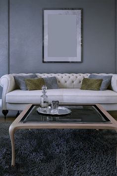 a living room with a white couch and coffee table