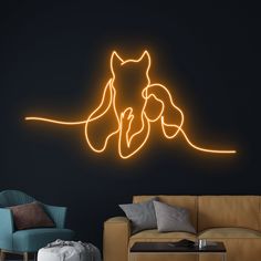 a living room with a couch, chair and neon sign