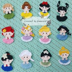 small crochet princesses are displayed on a blue tablecloth with the words crochet by emerald