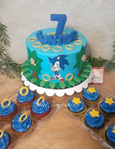 a sonic the hedgehog themed birthday cake and cupcakes