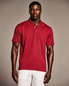 It's no wonder why we call this men's shirt our Essential Polo. Made of 100% polyester with moisture wicking, the polo shirt will keep you cool, dry and comfortable, whether you spend your weekends golfing or relaxing poolside. If you're more of an office polo kind of guy, you're in luck too. This men's polo can be easily dressed up with a jacket and dress pants or worn tucked in with slacks for a more casual work outfit. 100% Polyester Classic Fit Durable Ottoman Fabric Adds Ribbed Texture Mois Red Collared Polo Shirt For Sports, Classic Short Sleeve Moisture-wicking Shirt, Sporty Red Collared Polo Shirt, Classic Short Sleeve Moisture-wicking Polo Shirt, Red Polo Shirt For Sports, Moisture-wicking Solid Polo Shirt With Short Sleeves, Red Short Sleeve Top For Golf, Sporty Red Short Sleeve Polo Shirt, Textured Polo