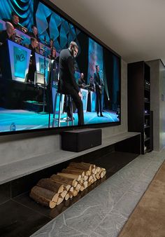 a large flat screen tv mounted to the side of a wall in a living room