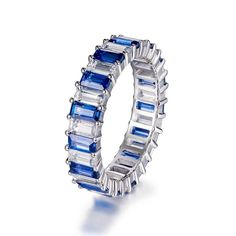 a blue and white diamond ring on a white background