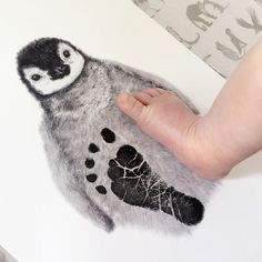 a baby's foot and hand are shown next to a drawing of an owl