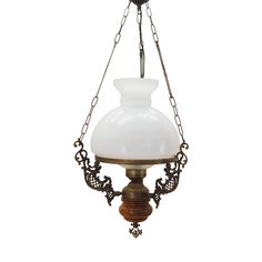 an old fashioned chandelier hanging from a chain