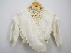 "Antique French blouse, Irish crochet lace yoke and embroidery with bows & flowers, Edwardian era white blouse, antique top Downton Abbey era. DESCRIPTION: Lovely antique French blouse, dating to the Edwardian era, batiste lawn with raised embroidered borders with bows and flowers design and an Irish crochet lace yoke with high neck. Automatic buttons closure on the back. CONDITION: Condition is very good for its age, there are no important issues to signal. MEASUREMENTS: Total length circa 16 3 French Blouse, Womens Blouses, Irish Lace Crochet, Flowers Design, Edwardian Era, Irish Crochet, Beautiful Clothes, Downton Abbey, White Blouse