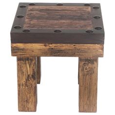 a small wooden stool with holes in it