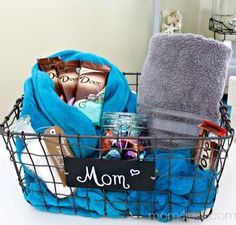 mother's day spa gift idea in a basket with towels and personalized items