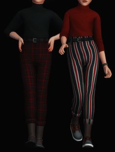 two women are standing next to each other with their hands on their hipss and one is wearing striped pants