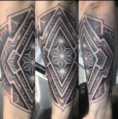 the legs are covered in black and grey ink with an intricate design on them, as well as stars