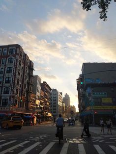 people are crossing the street at an intersection