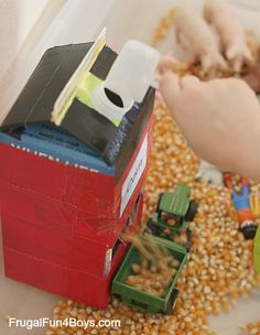 a child is playing with legos and corn